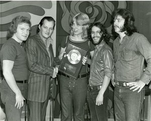 Stampeders with mel and engineer terry brown in the centre
