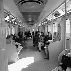 Hawker siddeley train interior view with passengers and exterior view in open cut. 1965