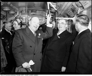 Mayor allan a. lamport %28centre%29 and metro chairman frederick g. gardiner %28second from right%29 at official opening of yonge street subway march 30th  1954