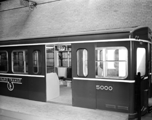 Subway car and advertising posters. 1953
